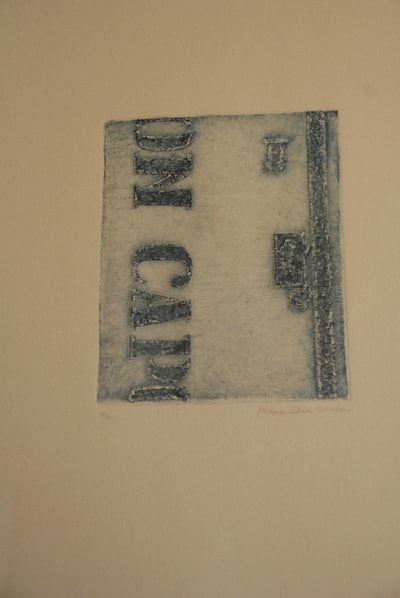 Weathered vintage label mounted on wall — print on found material by Elisa Sassera